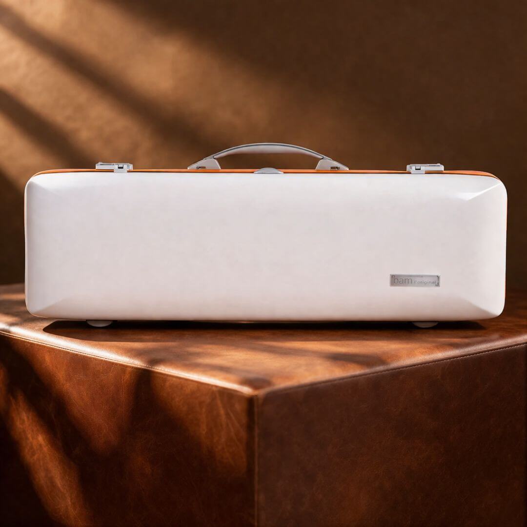 White Bam Ice Supreme Oblong Violin Case with an orange seal displayed on a brown leather pedestal