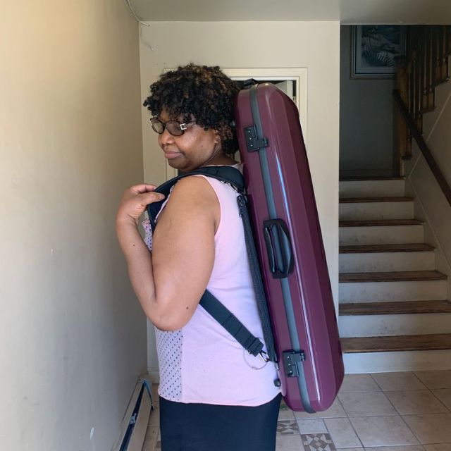Purple Gewa Air 2.1 Violin Case worn as a backpack